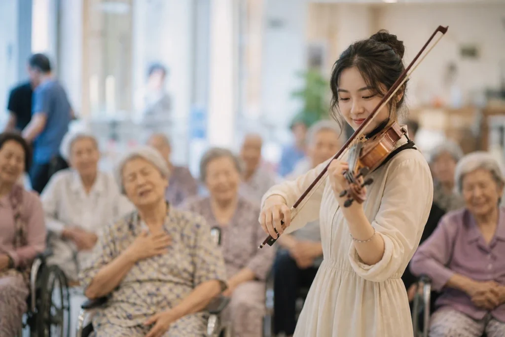 병원에서 봉사 활동 하는 음악 전공 학생